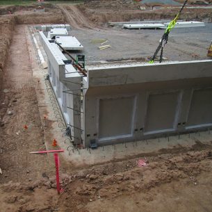 The concrete pool wall sections are set in place.